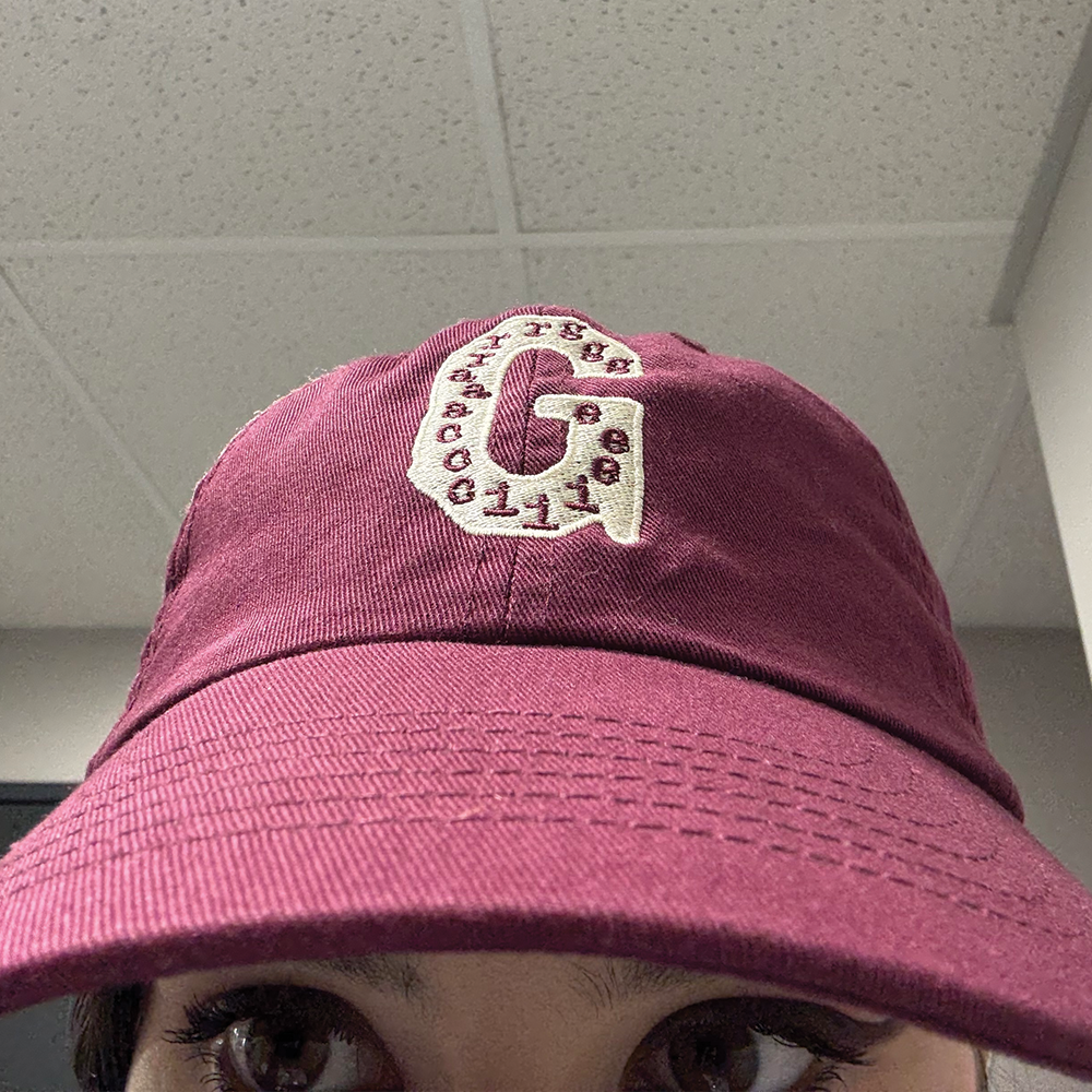 Gracie wearing G Abrams Maroon Adjustable Hat Close Up