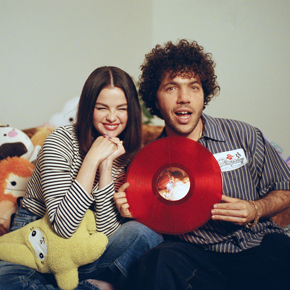 Selena and Benny holding I Said I Love You First (Candy Cane Red LP)